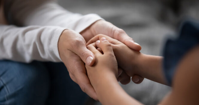 Hands of parents and children